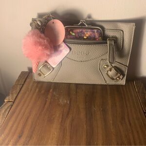 BCBG Taupe Clutch with Pink Pom Pom